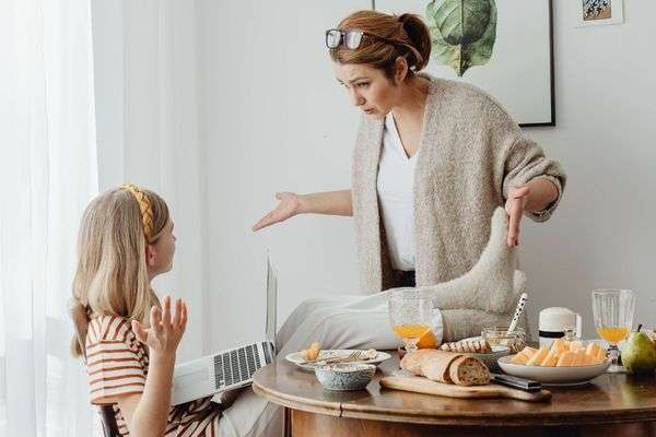 a girl arguing with mom over food