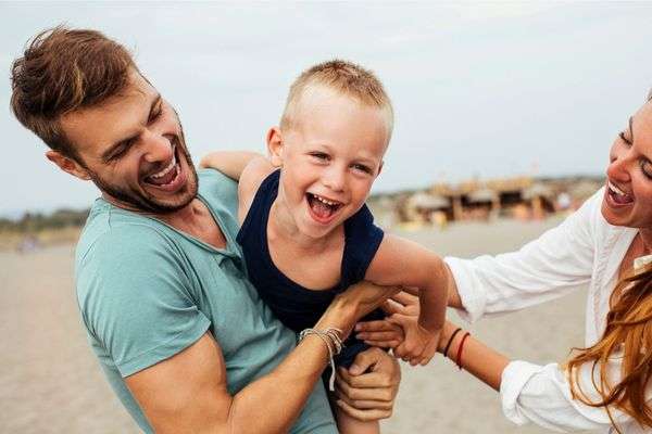 Kid playing with mom and dad