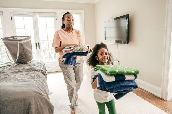 daughter doing chores with mom