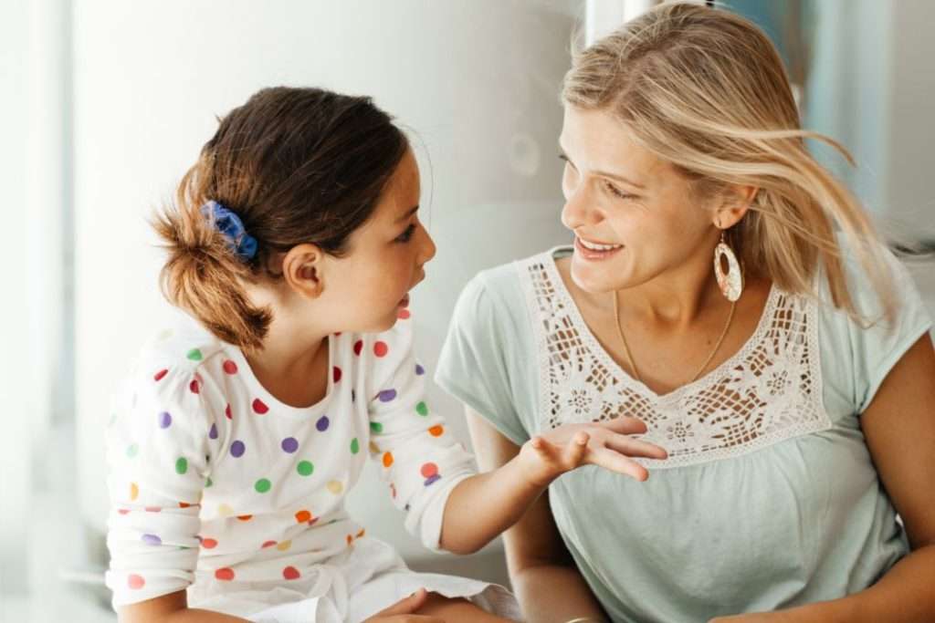 Mom talking to her daughter