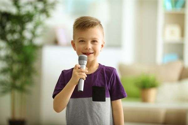 Child speaking on microphone