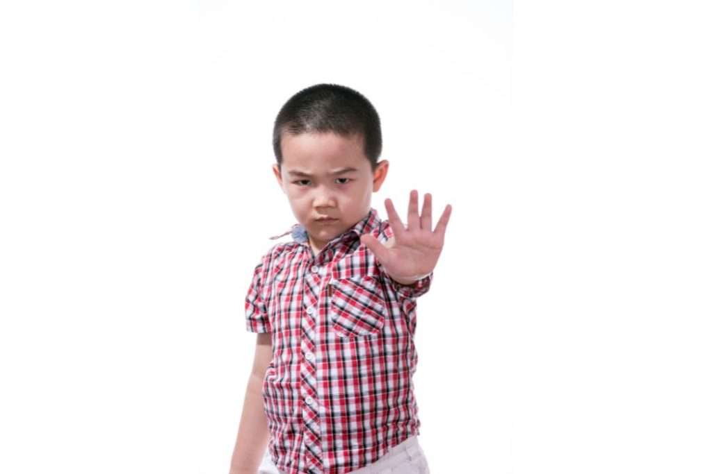 Child Raising hand to gesture NO