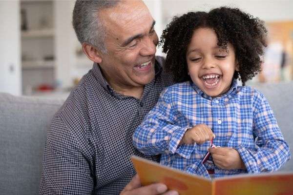 Child playing with his grand dad