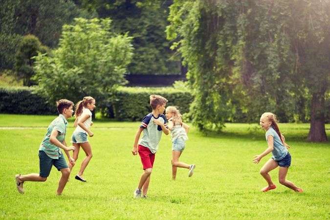 Kids playing in field outdoor