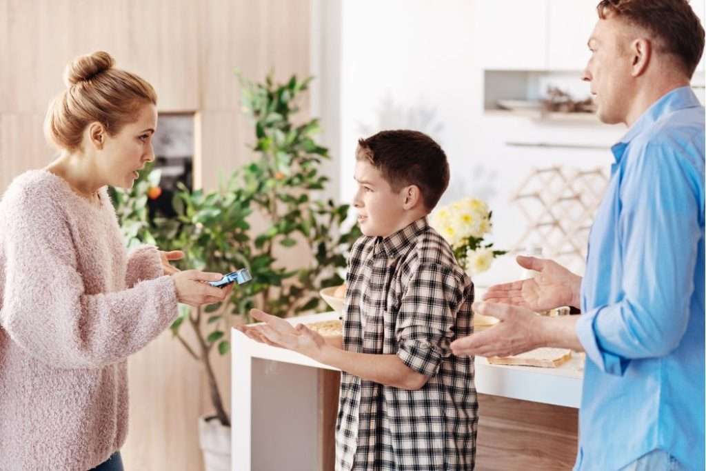 Parents discussing with kid in unfriendly tone