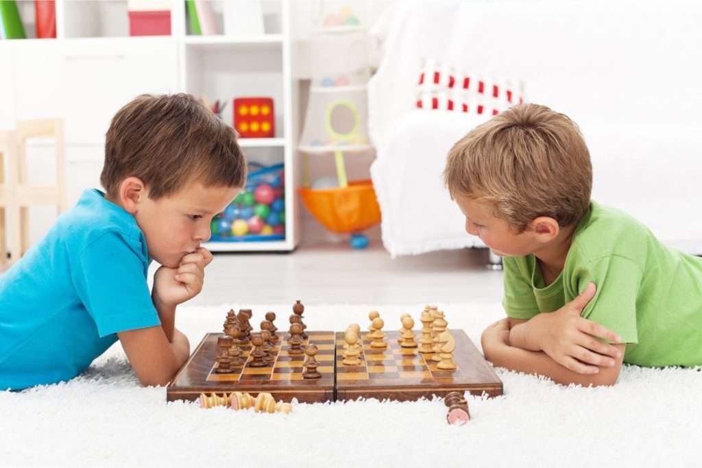 two kids playing chess