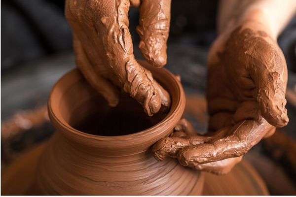 Potter moulding a pot